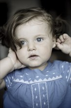 Close up of serious Caucasian baby girl