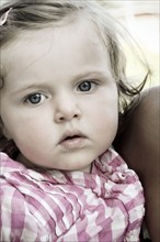 Close up of serious Caucasian baby girl