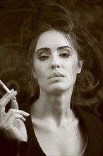 Caucasian woman smoking cigarette