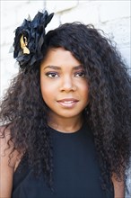 Black woman wearing flower in her hair