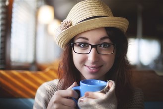 Caucasian woman drinking coffee