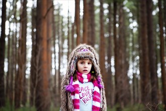 Caucasian girl standing in forest