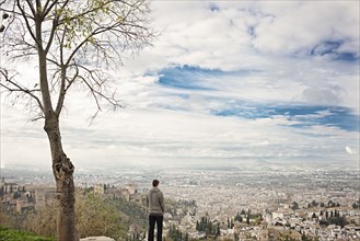 Man admiring scenic view of cityscape