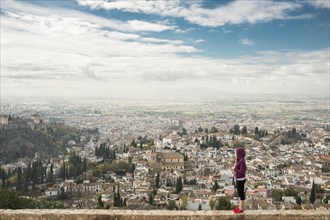 Caucasian woman admiring scenic view of cityscape