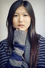 Asian woman with serious expression