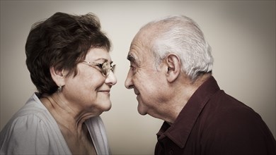 Senior Hispanic couple face to face