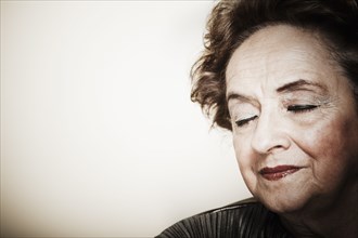 Senior woman with eyes closed