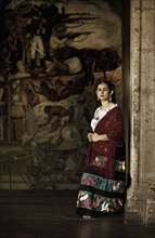 Hispanic woman in traditional clothing