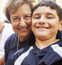 Smiling Hispanic grandmother and grandson