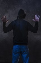 Caucasian man wearing black hoodie