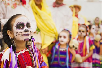 Hispanic children celebrating Dia de los Muertos