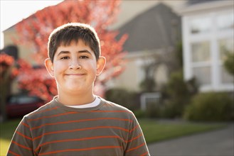 Hispanic boy smiling outdoors