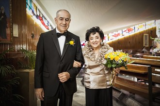 Senior couple smiling at wedding