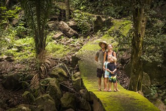 Caucasian family exploring jungle