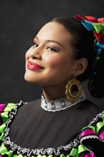 Hispanic teenage girl wearing Jallisco Folkloric dress