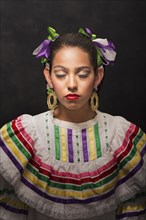 Hispanic teenage girl wearing Sinaloa Folkloric dress