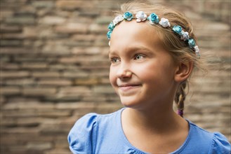 Smiling Caucasian girl wearing flower crown