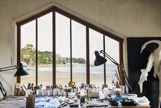 Window and desk in studio of artist