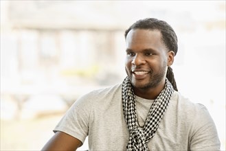 African American man smiling indoors