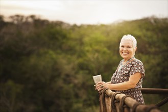 Woman smiling on balcony