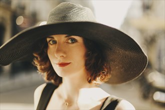 Caucasian woman wearing sun hat