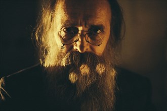 Caucasian man with beard and eyeglasses