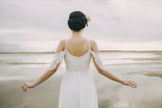 Caucasian bride at beach