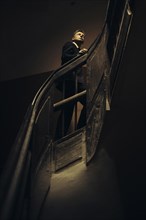 Caucasian businessman climbing staircase