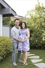 Portrait of smiling pregnant couple