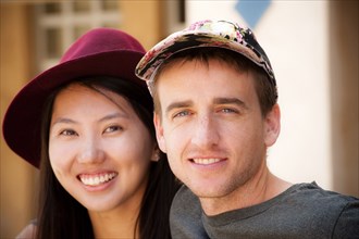 Portrait of smiling couple wearing hats