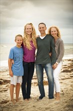 Portrait of smiling family at beach