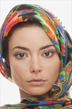 Serious Hispanic woman in elegant headdress