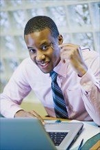 African American businessman sitting at desk