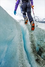 Caucasian ice climber on glacier