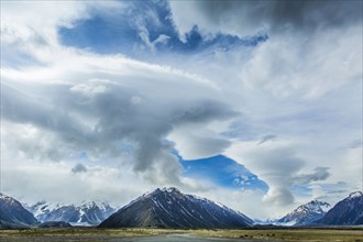 Cloudy sky over mountains and remote landscape