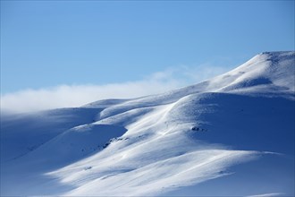 Snowy mountains in remote landscape