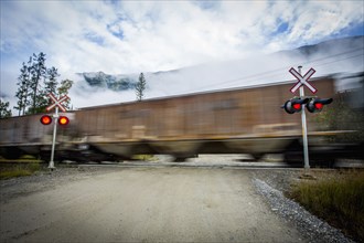 Train speeding through railroad crossing