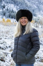 Caucasian woman wearing fur hat in winter