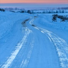 Ice on winding road in winter