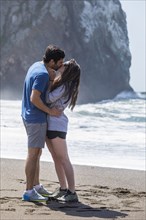 Couple kissing on beach