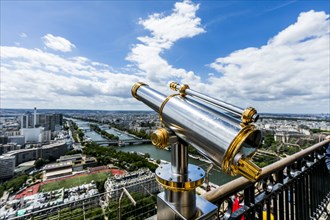 Telescope at scenic view of river in city