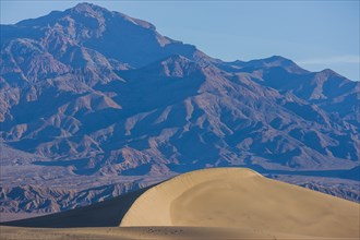 Sand dune near mountain landscape