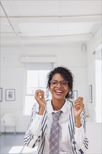 Mixed Race businesswoman laughing