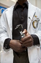 Close up of doctor holding medical tool in hospital