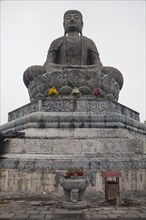 Low angle view of stone Buddha statue