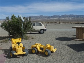 Toy bulldozers in rural desert park