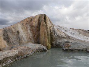 Rock formation over hot spring