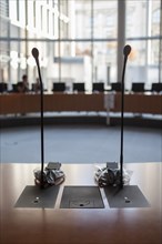 Microphones at desk in meeting room