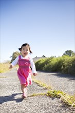 Girl running on path