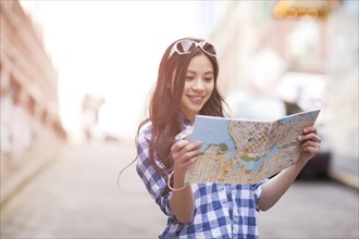 Chinese woman looking at map